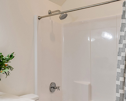 A Bathroom With a Bright New White Acrylic Shower Liner Panel