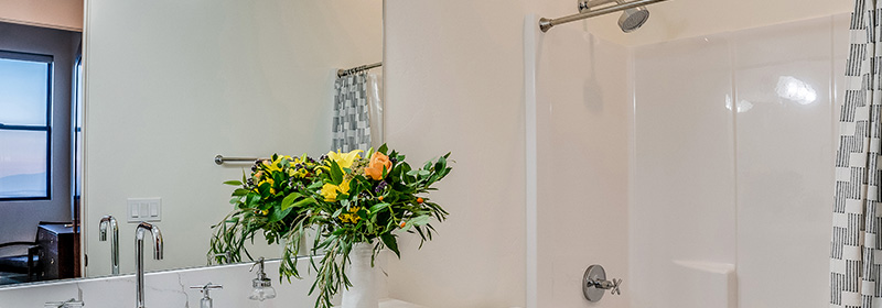 A Bathroom With a Bright New White Acrylic Shower Liner Panel